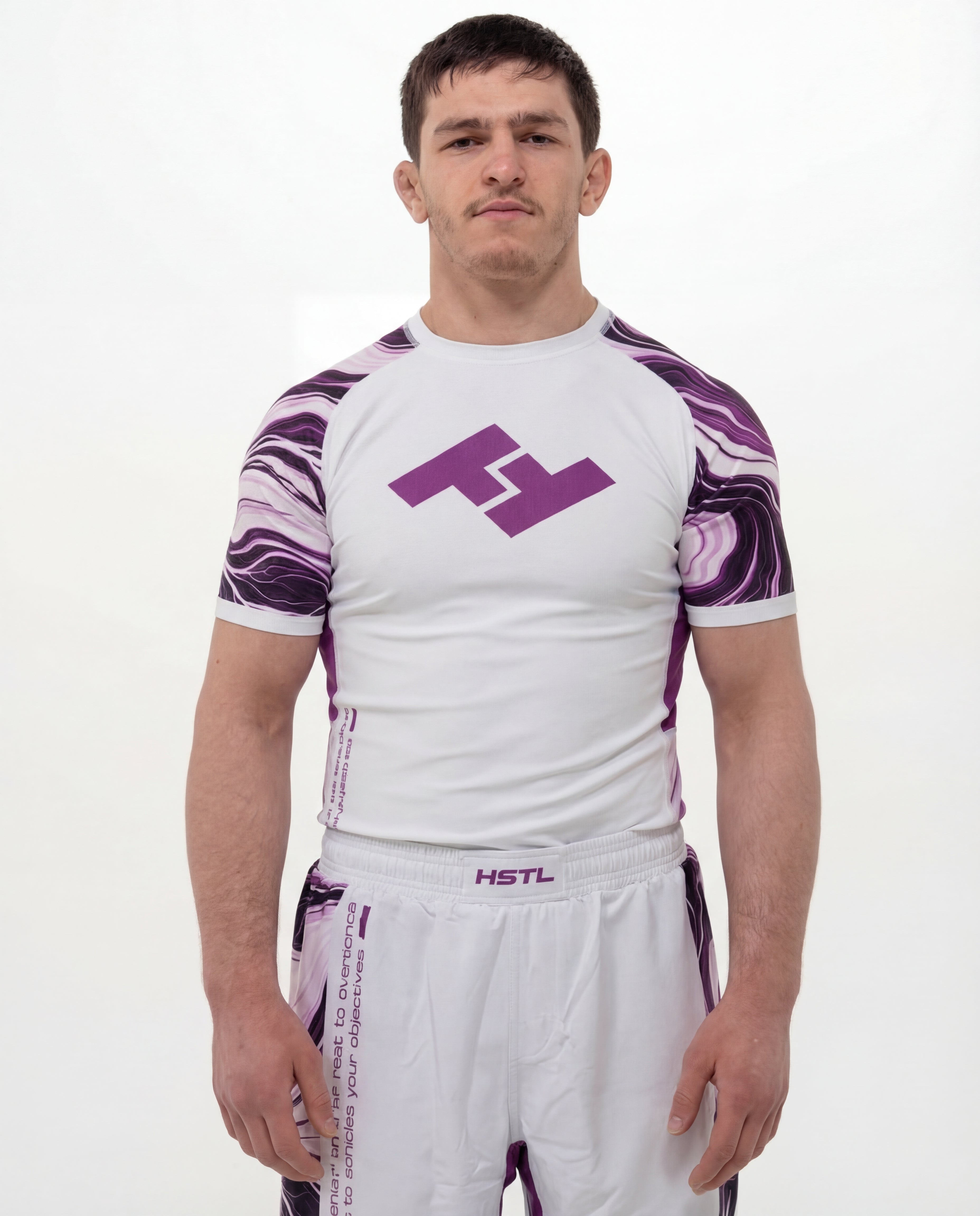 Rashguard Competitor V2 violet manches courtes raglan - comparatif Tatami Fightwear vs Hustle - Hustle Fightwear